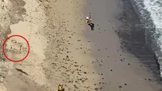 美国冲浪者被困偏僻海滩 用石头拼出“救命”后获救