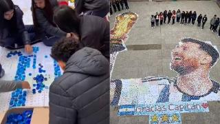纪念世界杯夺冠！阿根廷学生们用9万个瓶盖组成梅西捧杯肖像